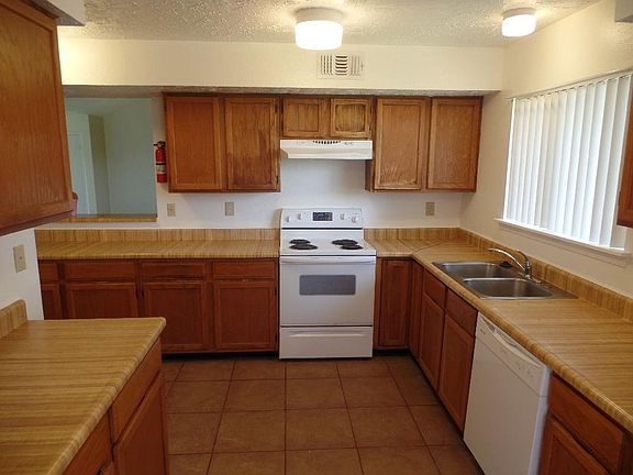 Plenty of kitchen area (8' x 12') with plenty of counter space gives you plenty of room to prepare those great meals for your family! Electric range, refrigerator, and dishwasher included.