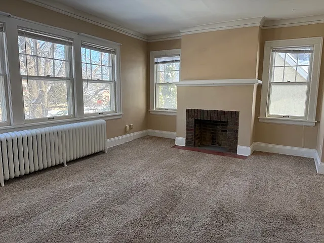 Photo 2 of 14 - 1676 Randolph Ave #2 - Saint Paul, MN Bright and spacious living room. Fireplace is decorative only. - 1676 Randolph Ave #2