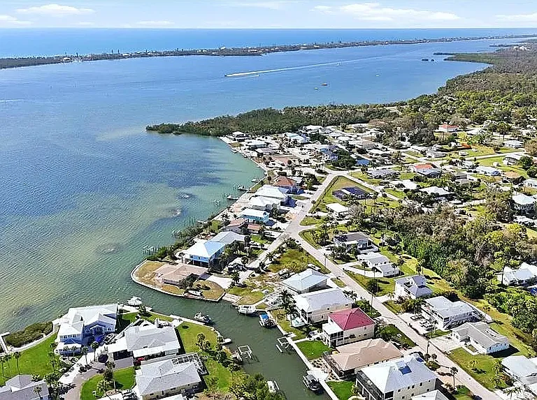Home located one block from the Intracoastal, offering sweeping view of the sun-glistening water