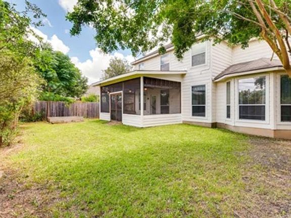 Screened in porch and backyard are perfect for enjoying time outside.