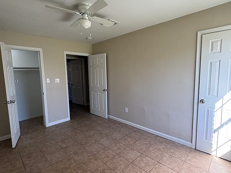 Master bedroom with a closet and it's own full bathroom.