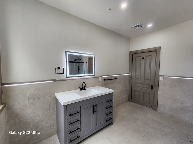 Bathroom Vanity with Plenty of Drawers and Modern Mirror