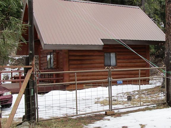 View side of cabin, fenced 