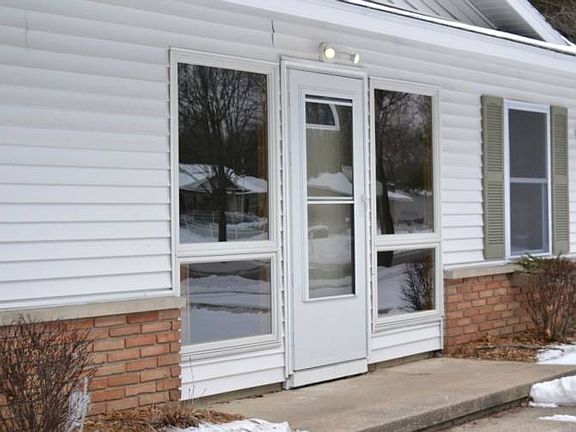 The front entrance is inviting and features all new windows.  The entire home has new windows for added savings in the winter and to allow plenty of natural light into the home.