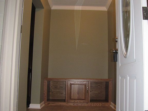 side door entry to mud room to hang your coat & hat