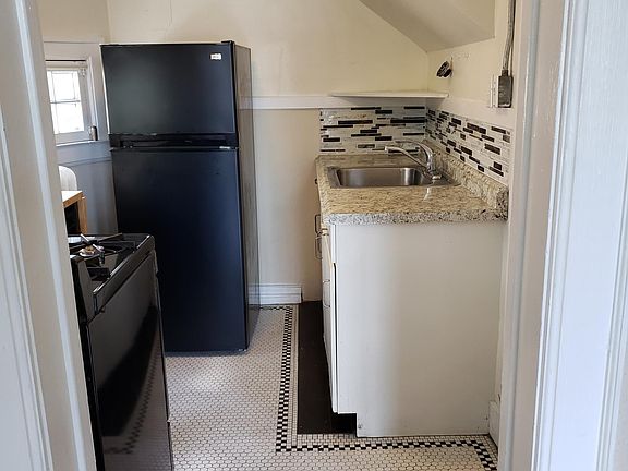 View of kitchen from front studio room