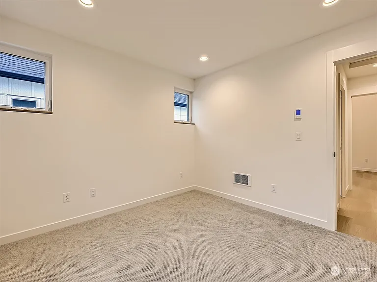 Second bedroom. Carpeted room. Serves as a great office!