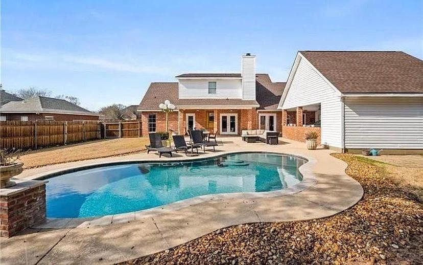 Back yard Oasis with Sparklin Pool that has now been Fenced.