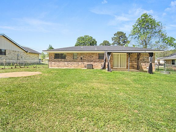 Spacious yard for family and furry pals.