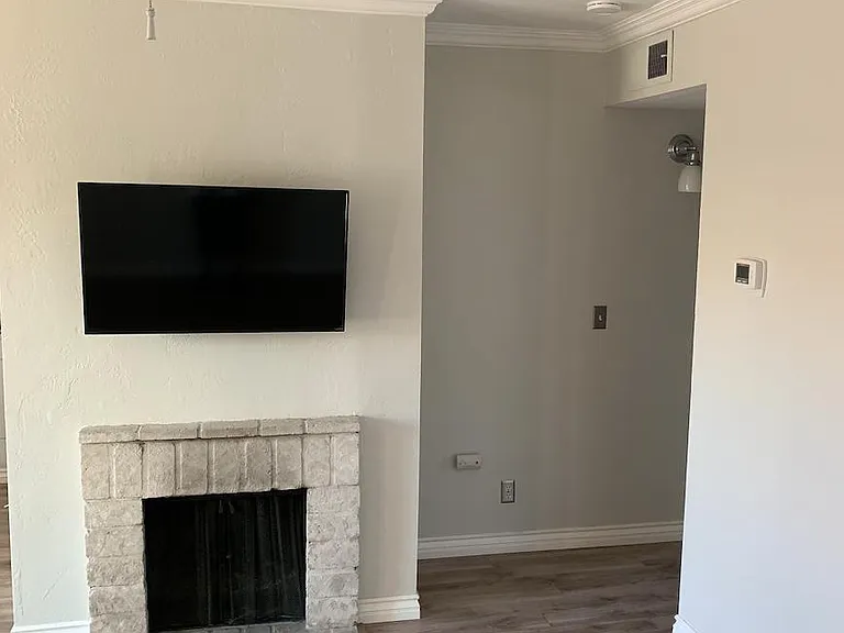 Living Room facing fireplace and hallway