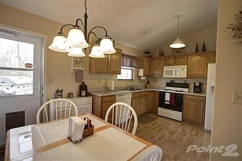 The kitchen offers a dishwasher, refrigerator and oven/range with plenty of cabinets and counter tops. The pantry offers adequate space for storage. In addition, there is a walkout onto the oversized multi-leveled deck that overlooks the rear fenced-in wooded yard. Set up a showing today and take advantage of this price and the amenities this home has to offer.