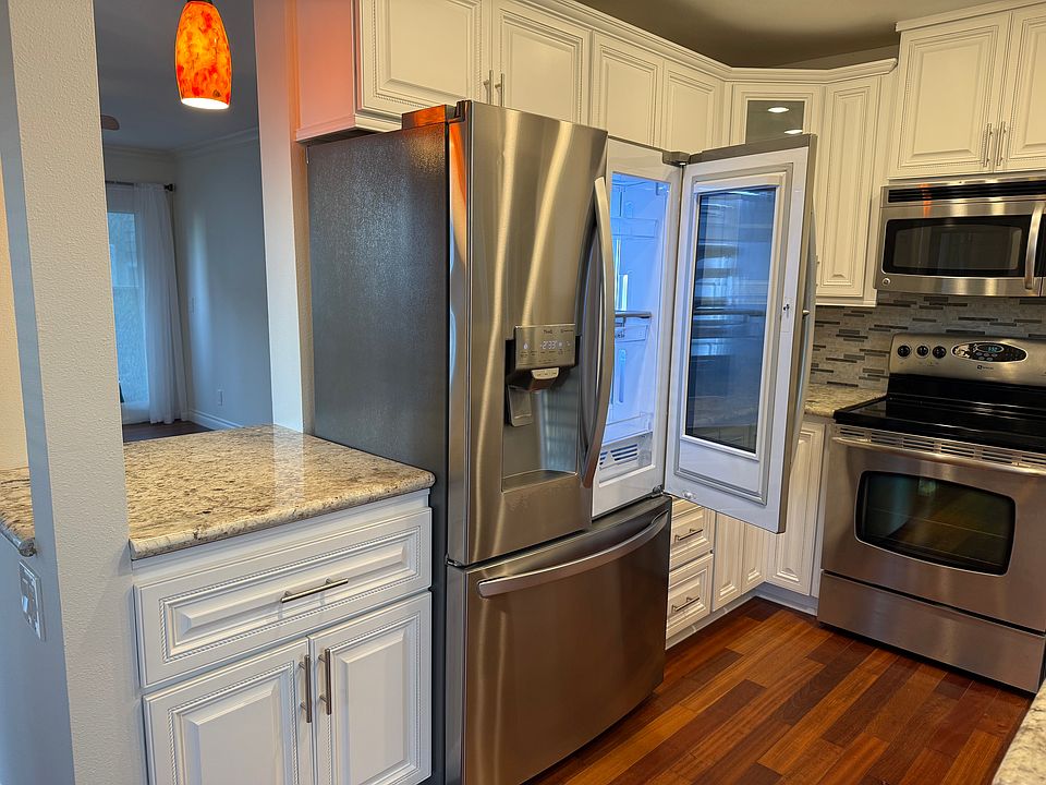 New top of the line four door refrigerator.