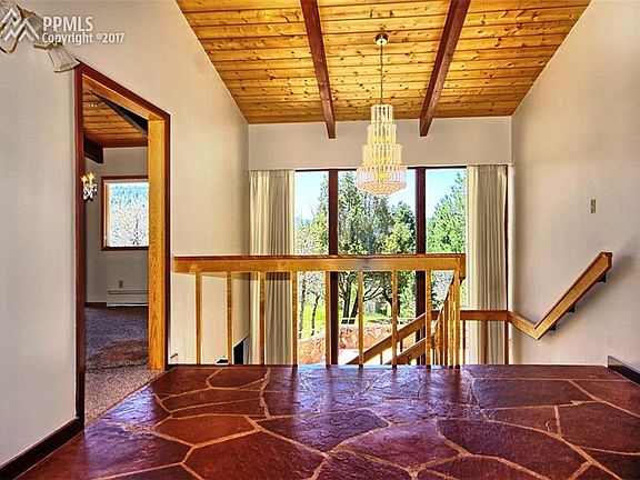 Large formal foyer, 2 story glass windows giving great views.