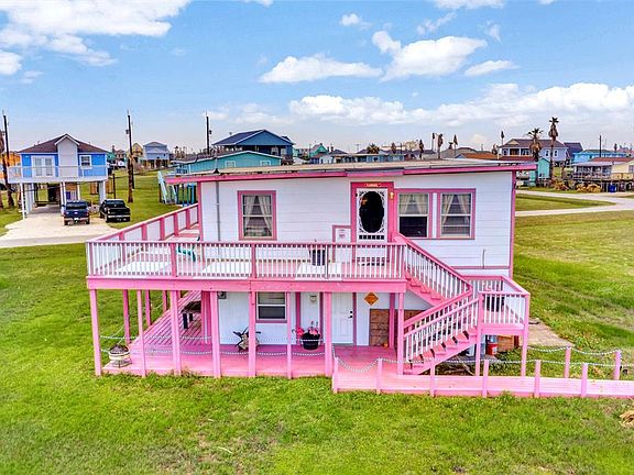 Bottom level has a deck that wraps around the fromt and side of the home.