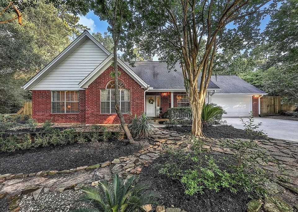Welcome to 2420 Canter Lane, in the peaceful forested neighborhood of Carriage Hills!