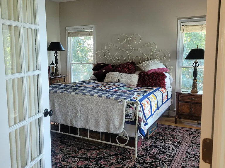 Primary bedroom on mail level - lake front with great view.