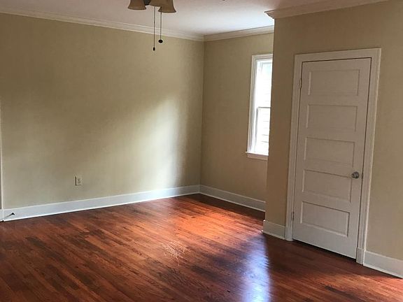 View from kitchen showing the beautiful hardwood floors again and the closet door.