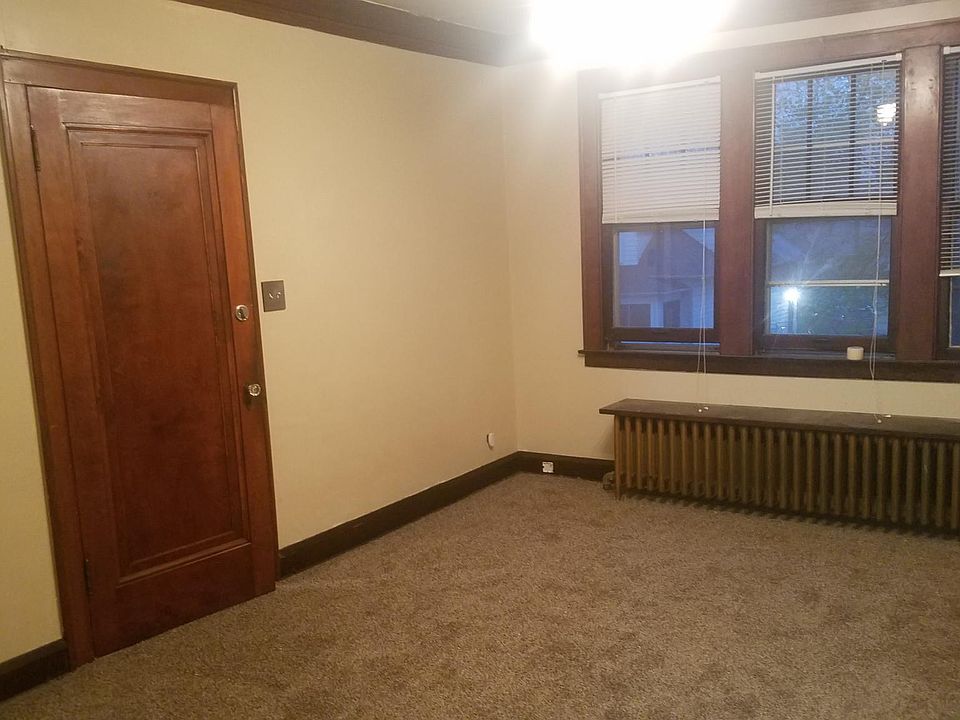 Living Room - entry door from stairs and 3 windows in front - Great room and sunlight!