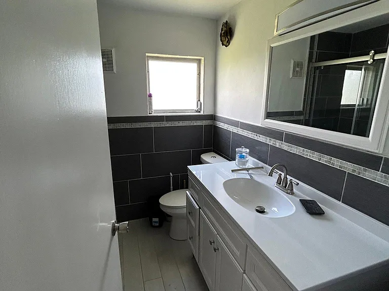 Bathroom # 1 - on septic system; walk-in shower; linen closet behind door.