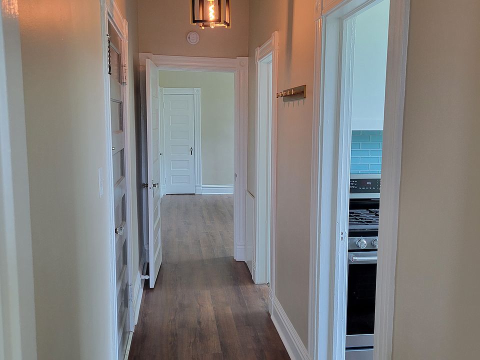 Updated brass light fixture, brass coatrack