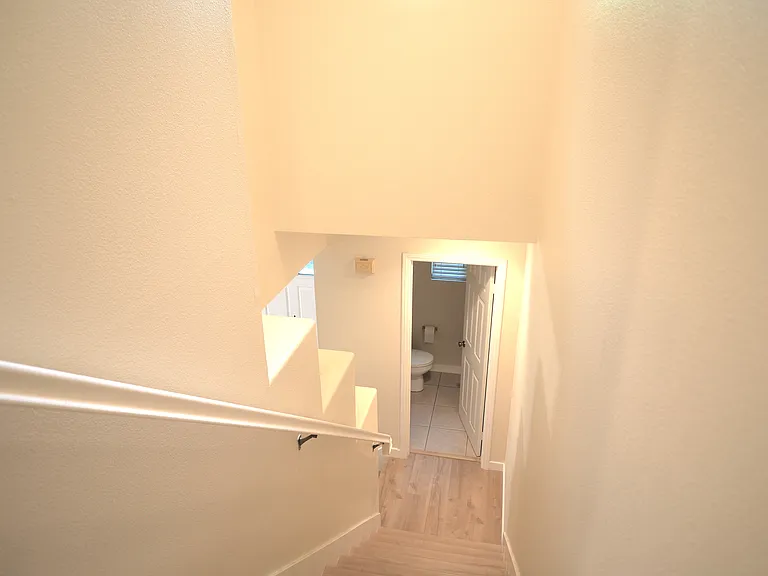 Stairs to the main floor and half bathroom.