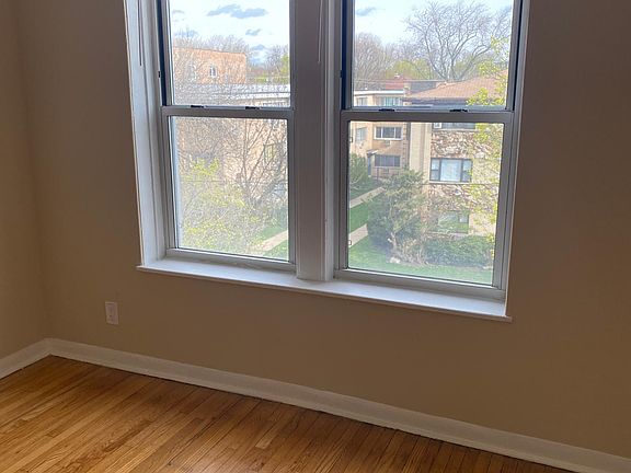 looking out of the dining room windows and newly finished hardwood floors