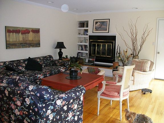 large light filled living room with gas fireplace