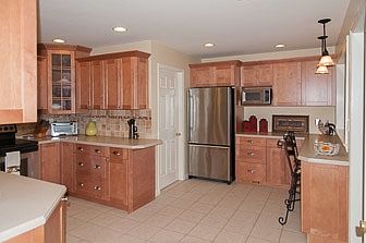 Beautifully redesigned kitchen with tile floor....