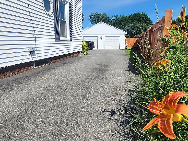 driveway and garage (partial use of garage included in rental)