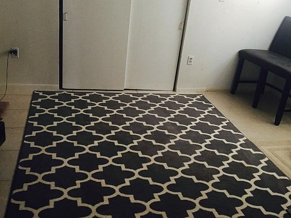 Largest 3rd bedroom by the kitchen. This room also includes the laundry unit.