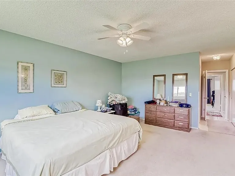 Master bedroom comes with two large closets, master bathroom, ceiling fan, and golf course view. The walls in this room have been recently painted to light gray. 

*This unit is unfurnished. All furniture has been removed.