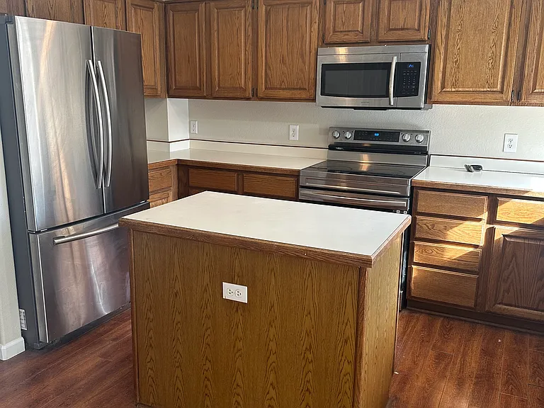 Large refrigerator with ice maker.
