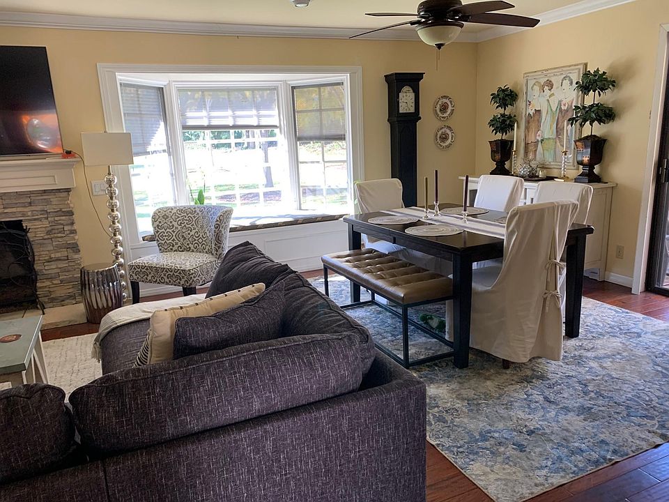 Living room to the left and dining room to the right with a nice bay window