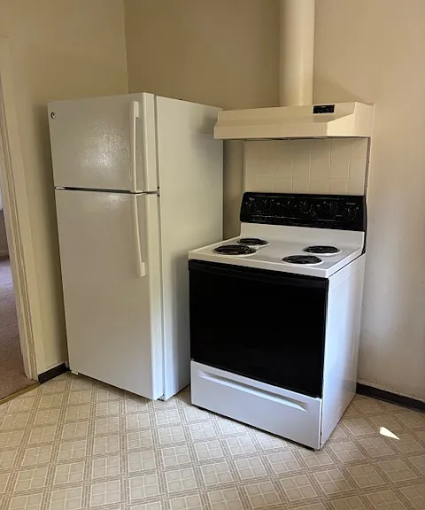Kitchen - refrigerator and stove