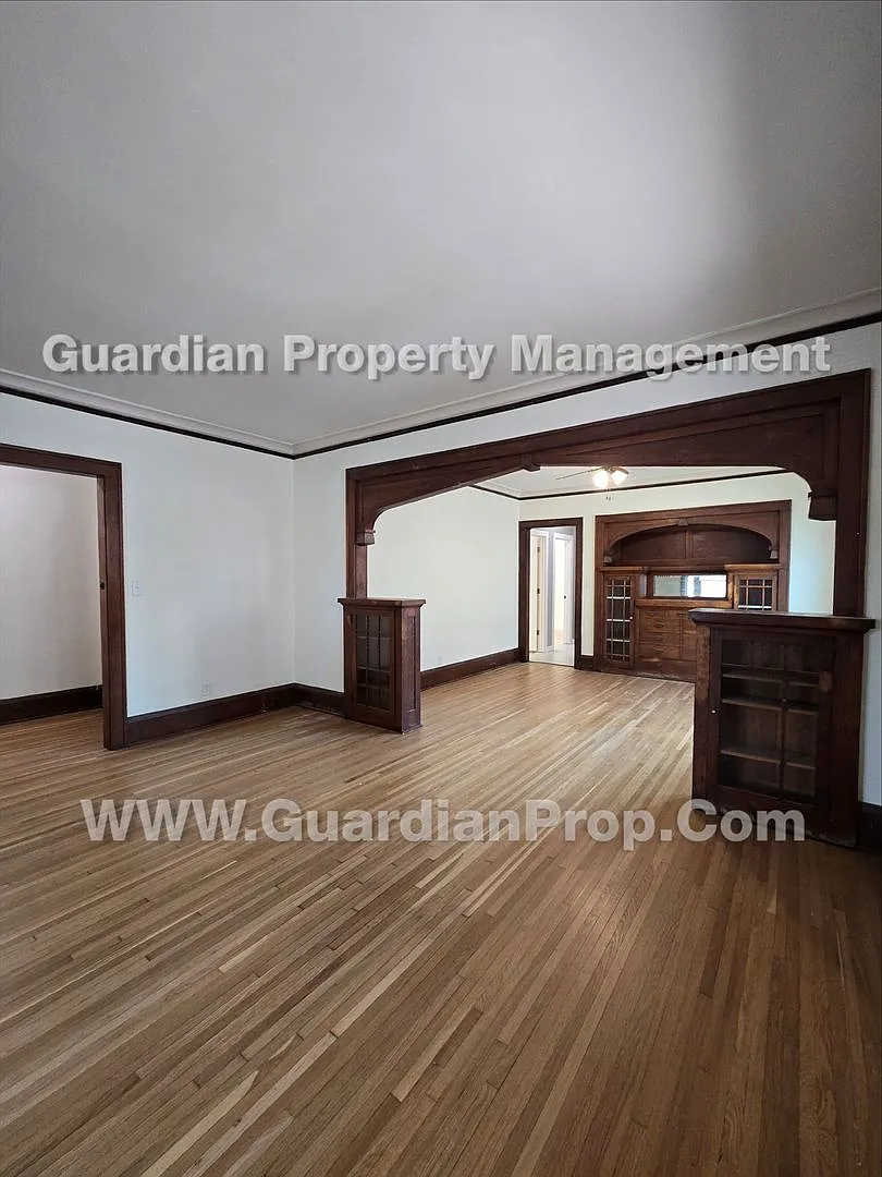Large main floor duplex unit, Updated Kitchen & Bath, Full Dining Room w/Built-ins + Sunroom, gar... — Photo 1