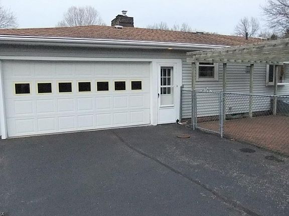 Attached 2-1/2 car garage at rear of home.