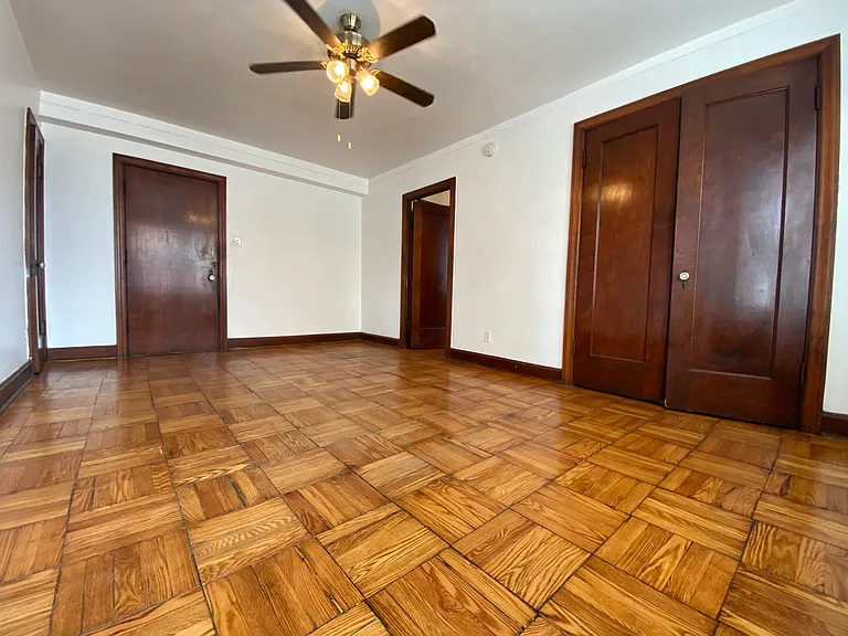 Parquet wood flooring throughout.