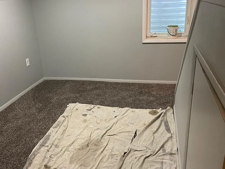 downstairs bedroom and another room for an office and or tv