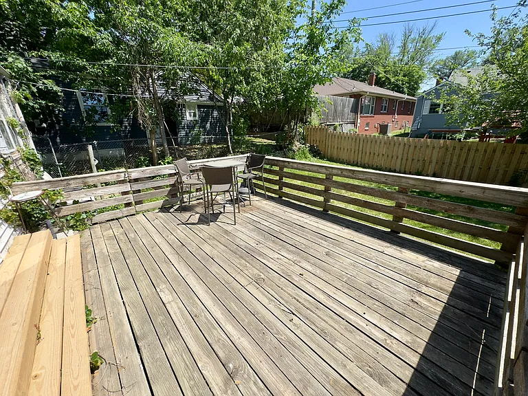 Backyard deck and fenced in yard