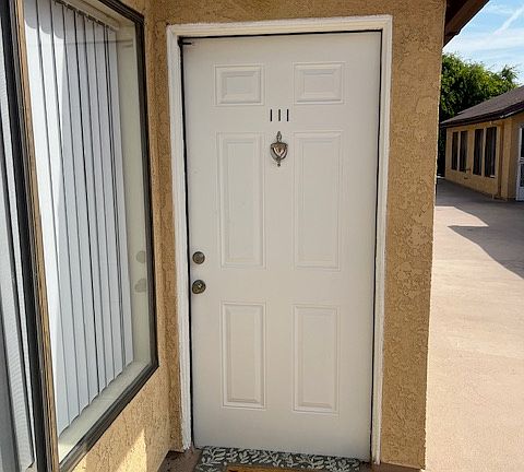 Walk up steps from parking level to this first floor residence.