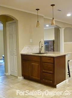 Pennisula and Pantry View : Granite prep-sink. Pendant Lighting. 15 inch overhang. Large Reach-In Pa