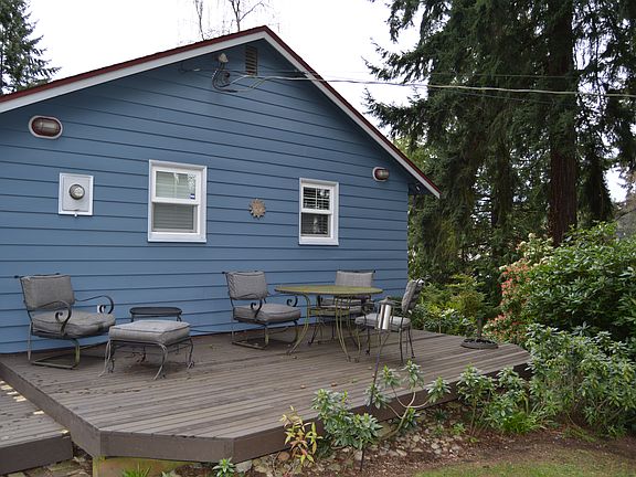 Spacious side/rear yard with deck for entertaining.