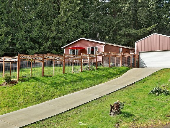 Perched amongst cedars, this sweet home is move-in ready! 