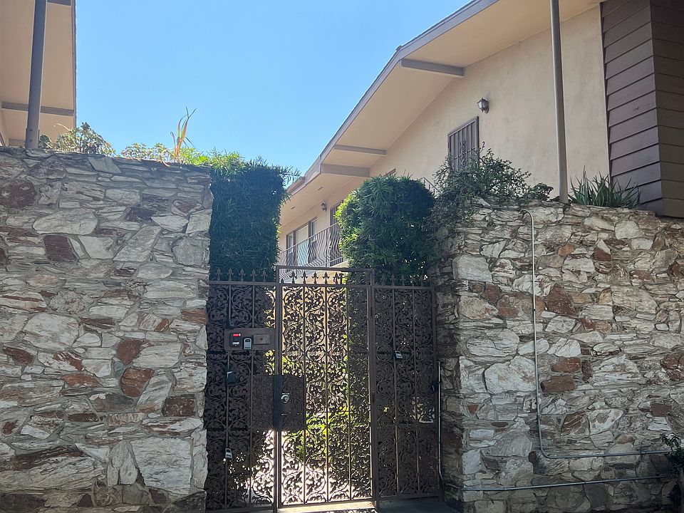 Front security gate of the complex. Door opens onto landscaped 
garden-like courtyard open space area shared by all.