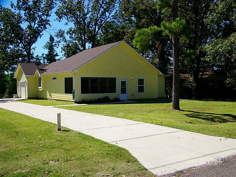 "Home Sweet Home". Notice the extended CONCRETE Driveway and the Huge Front Yard! The Big Window on 