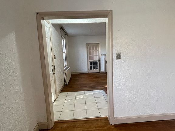Dining room through to living room and sunroom/office/library