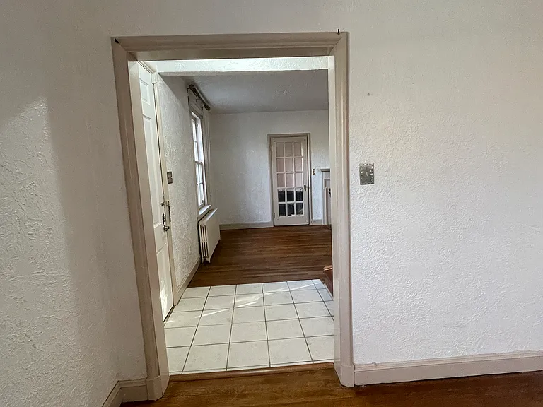 Dining room through to living room and sunroom/office/library