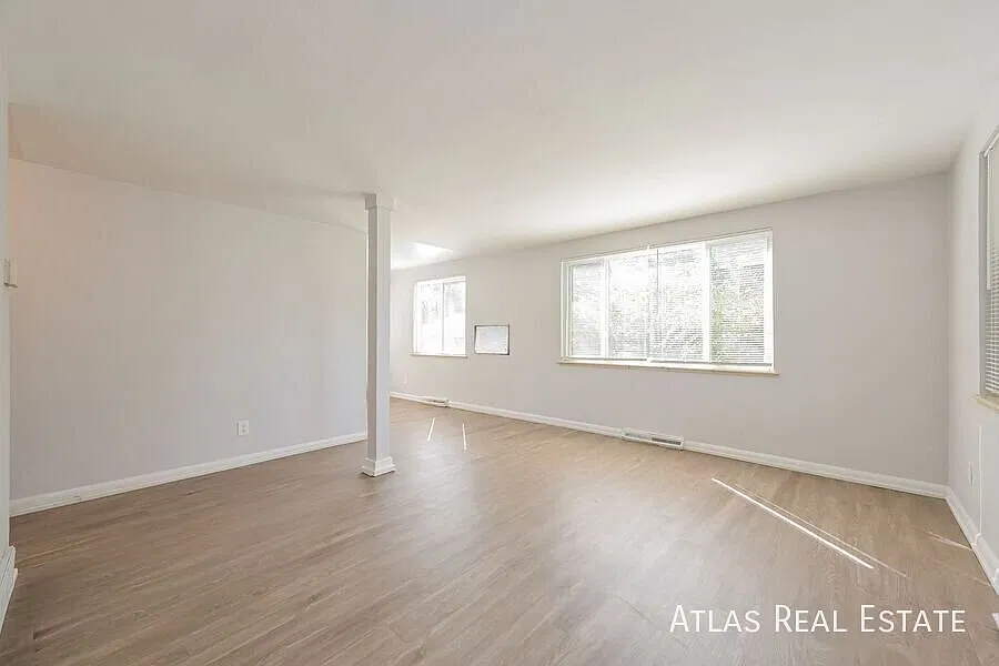 Save $1095! Large 2 Bed and 1 Bath Main Level Unit - Abundant Lighting, Hard Floors, Off Street P... — Photo 3