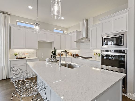 Kitchen in the Glacier home plan by Trophy Signature Homes - REPRESENTATIVE PHOTO