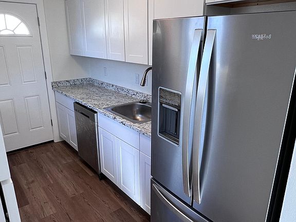 Brand new kitchen! New floor, countertops, appliances, garbage disposal, and sink!